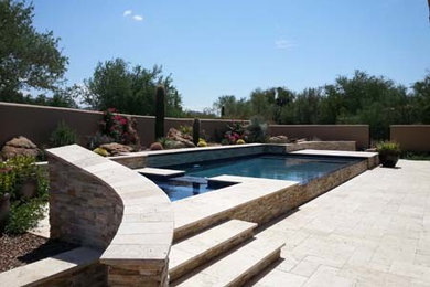 Inspiration for a rustic pool remodel in Phoenix