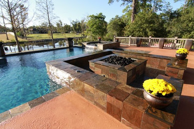 Trendy backyard custom-shaped pool fountain photo in Other