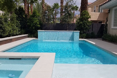 Inspiration for a contemporary backyard rectangular pool remodel in Las Vegas
