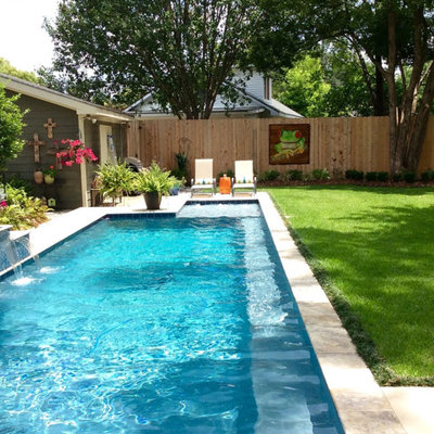 Example of a mid-sized classic backyard concrete paver and l-shaped lap pool fountain design in San Diego