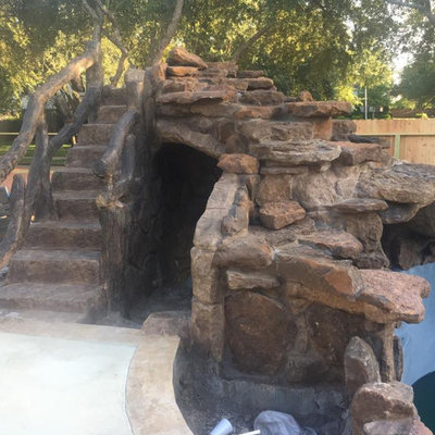 Inspiration for a mid-sized rustic backyard custom-shaped and concrete natural water slide remodel in Orange County