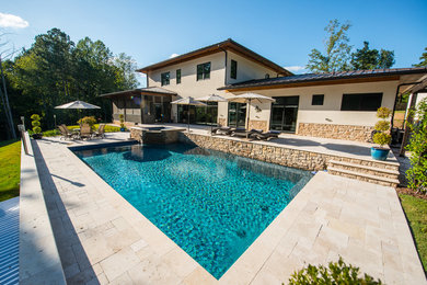 Large contemporary swimming pool in Raleigh.