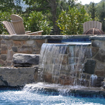 Custom Salt Water Pool with Raised Spa, Waterslide, and Outdoor Kitchen