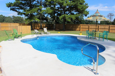Inspiration for a mid-sized timeless backyard custom-shaped pool remodel in Atlanta