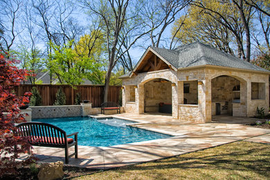 Mid-sized elegant backyard stone and rectangular lap pool house photo in Dallas