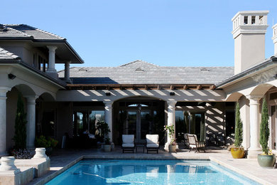 Inspiration for a large mediterranean backyard concrete paver and rectangular natural hot tub remodel in San Luis Obispo