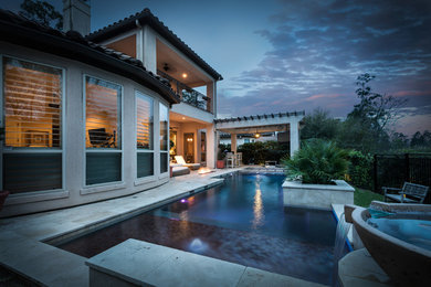 Example of a small trendy backyard rectangular pool design in Houston with decking