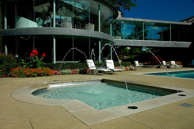 Pool fountain - modern backyard custom-shaped pool fountain idea in Columbus with decking