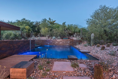 Pool - large industrial backyard rectangular natural pool idea in Phoenix