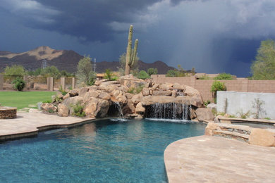 Island style pool photo in Phoenix