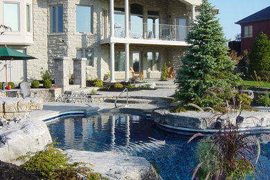 Inspiration for a large timeless backyard pool remodel in Toronto