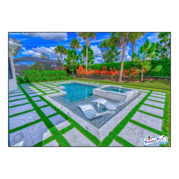 (Dunn) NAPLES, FL Superior Pools Custom Turf & Travertine Deck Pool & Spa.