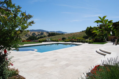 Inspiration for a huge mediterranean backyard stone and custom-shaped hot tub remodel in San Francisco