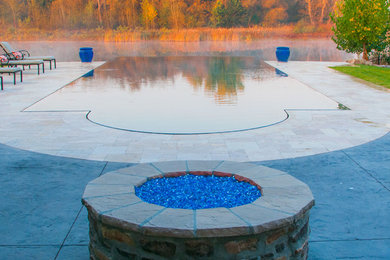 Pool - backyard custom-shaped infinity pool idea in Boise