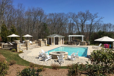 Pool house - modern backyard stone and rectangular natural pool house idea in Providence