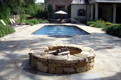 Large elegant backyard stone and custom-shaped natural pool fountain photo in Houston