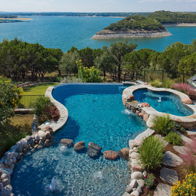Inspiration for a timeless custom-shaped infinity hot tub remodel in Austin