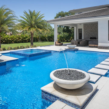 Edgy Pool With Custom Bowls and Stepping Stones in Plantation, Florida