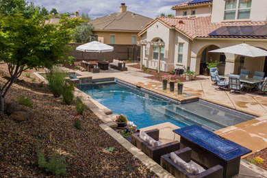 Pool fountain - large contemporary backyard tile and rectangular lap pool fountain idea in Sacramento
