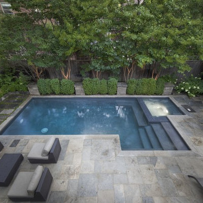 Example of a small trendy backyard stone and rectangular hot tub design in Toronto