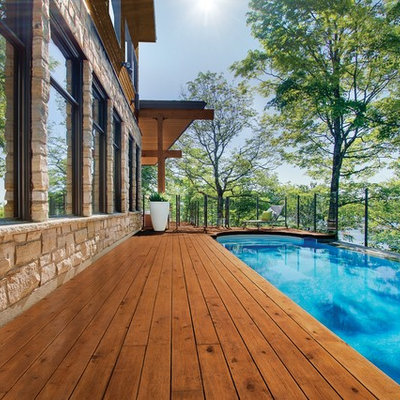 Mid-sized trendy side yard pool photo in Other