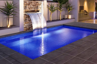Minimalist backyard rectangular pool photo in Perth
