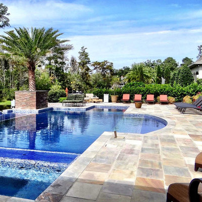 Hot tub - mid-sized tropical backyard tile and rectangular lap hot tub idea in New Orleans