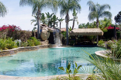 Island style pool photo in San Diego