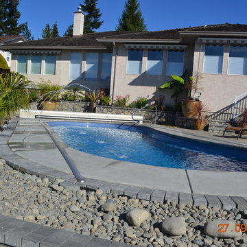 Fibreglass Pool in Saanich with Beautiful Stone Walls