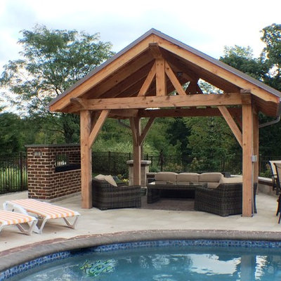 Pool - small craftsman backyard concrete paver and custom-shaped pool idea in Philadelphia