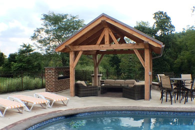 Pool - small craftsman backyard concrete paver and custom-shaped pool idea in Philadelphia