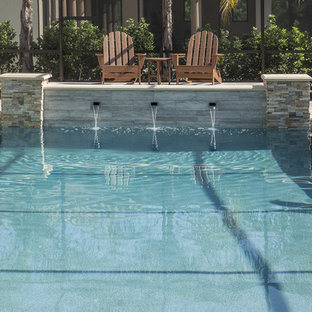 Diseño de piscinas y jacuzzis alargados, contemporáneos, grandes, interiores y en forma de L, con suelo de baldosas