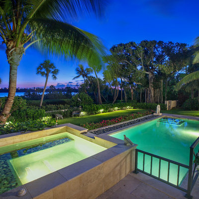 Inspiration for a tropical backyard tile and rectangular lap hot tub remodel in Miami