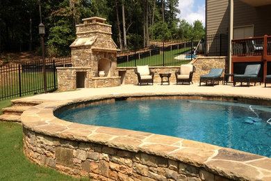 Pool - mid-sized traditional backyard stone and custom-shaped natural pool idea in Atlanta