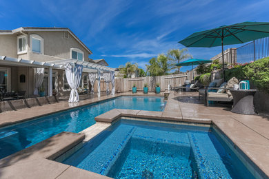 Pool fountain - mid-sized traditional backyard concrete and rectangular pool fountain idea in Sacramento