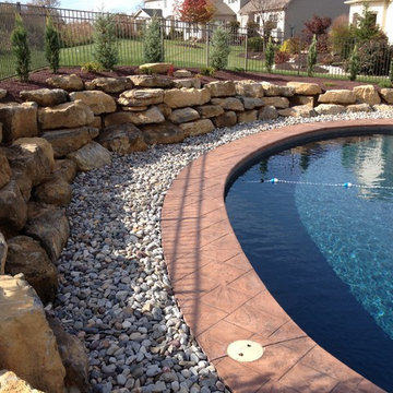 Forks Township kidney shape pool with boulder retaining wall
