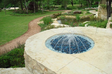 Backyard stone pool fountain photo in Dallas