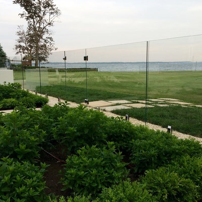 Inspiration for a large contemporary backyard tile and rectangular natural pool remodel in New York