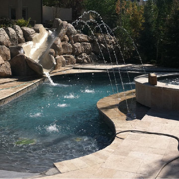 Free Form Pool with Hot Tub, Faux Rock Slide & Deck Jets
