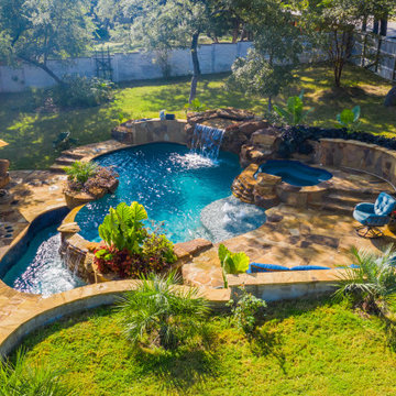 Freeform Pool with Negative Edge, Grotto, and Spa