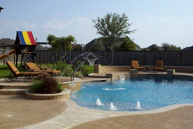 Example of a mid-sized classic backyard concrete and custom-shaped hot tub design in Houston