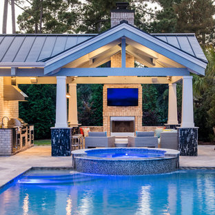 Pool house - large transitional concrete paver and rectangular pool house idea in Other