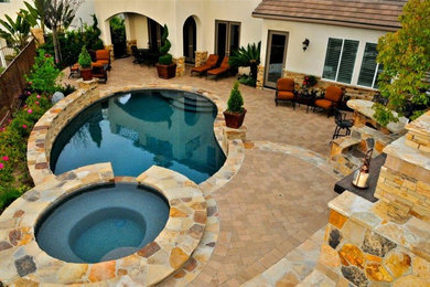 Inspiration for a traditional swimming pool in Orange County.