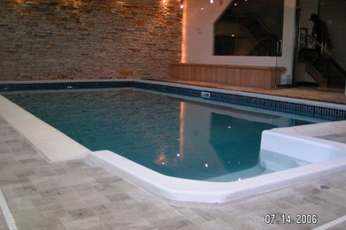 This is an example of a large traditional indoor rectangular swimming pool in New York.