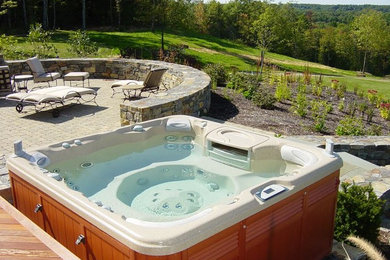 Inspiration for a backyard aboveground hot tub remodel in Portland Maine