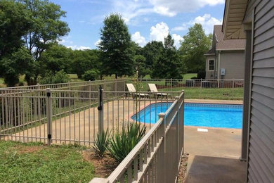 Inspiration for a timeless backyard natural pool remodel in Nashville