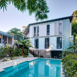 Photo of a tropical courtyard rectangular lap pool in Sydney.