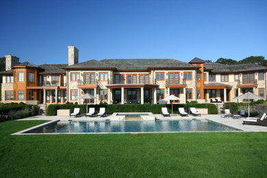 Pool - traditional backyard stone and rectangular pool idea in New York