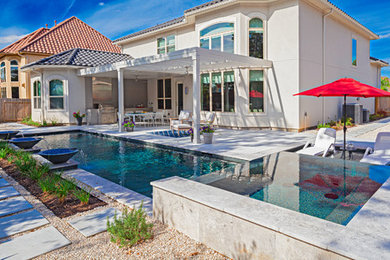 Pool fountain - mid-sized contemporary backyard concrete and rectangular pool fountain idea in Houston