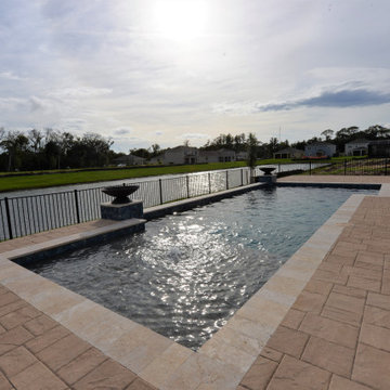 Geometric Swimming Pool with Fire bowls in St. Cloud, Florida